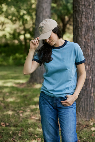 woman wearing blue ringer tee