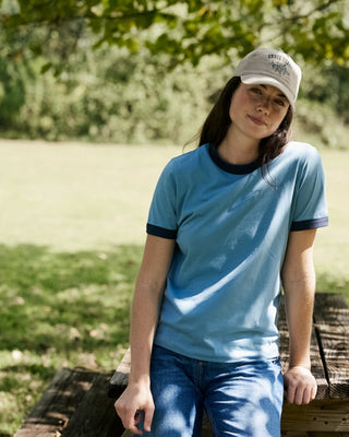 woman wearing blue ringer tee